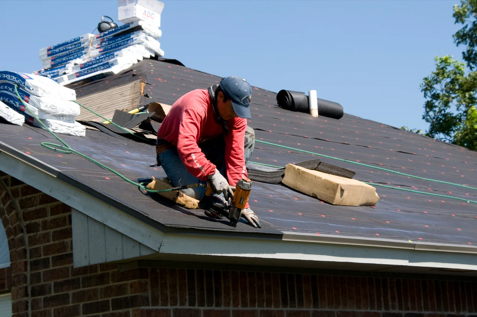 Close view of shingle roofing and intersecting rooflines